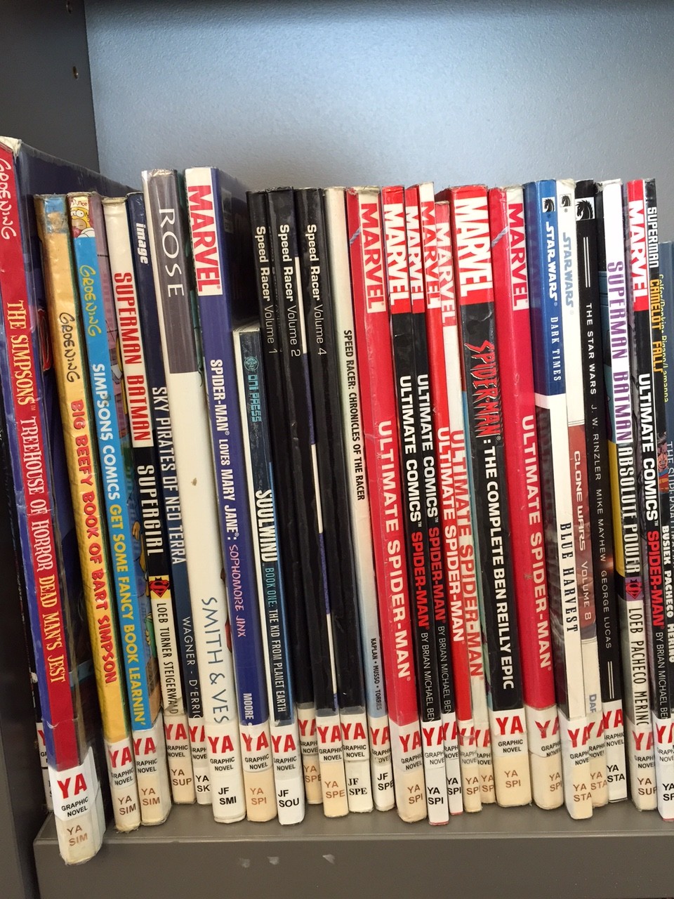 Comics ordered by series with spine labels.